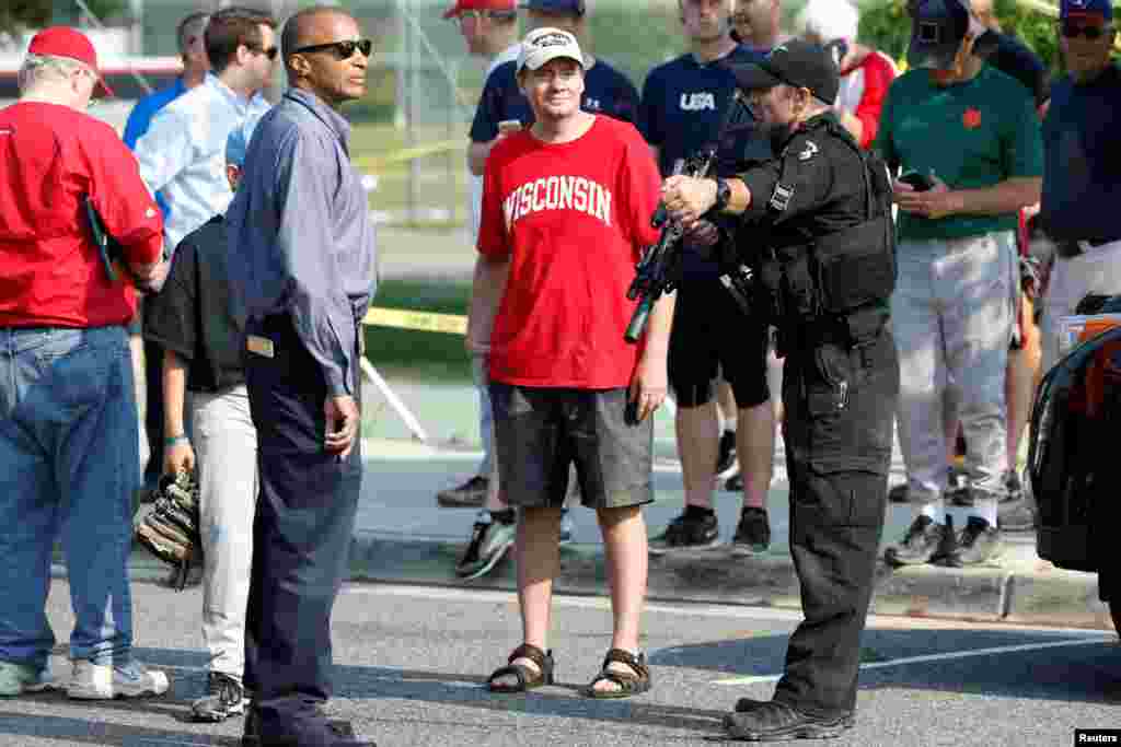 Police investigate a shooting scene after a gunman opened fire on Republican members of Congress during a baseball practice near Washington in Alexandria, June 14, 2017.