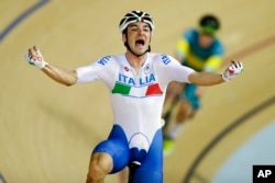 Elia Viviani of Italy celebrates after winning gold in the men's omnium cycling event at the Rio Olympic Velodrome during the 2016 Summer Olympics in Rio de Janeiro, Brazil, Aug. 15, 2016.