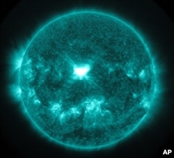 This image provided by NASA, shows an extreme ultra-violet wavelength image of solar flare captured about 1:45 p.m. EDT, Sept. 10, 2014.