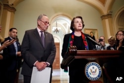 Senate Judiciary Committee Ranking Member Sen. Dianne Feinstein, D-Calif., speaks to the media, accompanied by Senate Minority Leader Chuck Schumer, D-N.Y., about the FBI report on sexual misconduct allegations against Supreme Court nominee Brett Kavanaugh, on Capitol Hill, Oct. 4, 2018 in Washington.