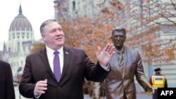 U.S. Secretary of State Mike Pompeo is pictured next to the statue of the former U.S. president Ronald Reagan at the Liberty square (Szabadsag) in Budapest, Hungary, Feb. 11, 2019.