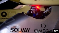 Bertrand Piccard, pilot of the Swiss sun-powered aircraft Solar Impulse prepares the craft for take off at the Barajas airport in Madrid, June 5, 2012.