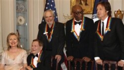 Secretary of State Hillary Clinton, left, talks with Kennedy Center honorees, Jerry Herman, Merle Haggard, Bill T. Jones and Paul McCartney while waiting for Oprah Winfrey to arrive