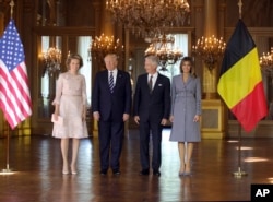 President Donald Trump, second left, and his wife Melania, right, pose with Belgium's King Philippe and his wife Queen Mathilde at the Royal Palace in Brussels, May 24, 2017.