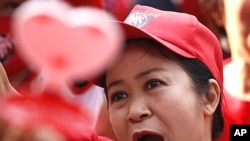 A woman takes part in the 'Red Shirt' anniversary protest at Ratchaprasong Intersection in Bangkok, Thailand, May 19, 2011.