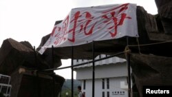 Um cartaz na Universidade de Hong Kong, na China, diz: "Boicote às aulas em protesto"
Setembro 20, 2014.