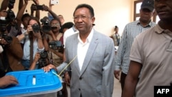 Malagasy presidential candidate and former president Hery Rajaonarimampianina looks on after casting his ballot at the CEG (college d 'enseingnement general) Voting Station at Tsimbazaza, Nov. 7, 2018 in Antananarivo, Madagascar. 