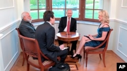NBC journalist Megyn Kelly interviews India's Prime Minister Narendra Modi (left) and Russian President Vladimir Putin (center) in the Constantine Palace at the St. Petersburg International Economic Forum in St. Petersburg, Russia, June 1, 2017. 