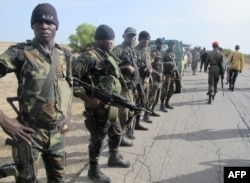 FILE - Cameroon's army soldiers deploy against the Nigerian Islamist group Boko Haram in Dabanga, northern Cameroon, June 17, 2014.