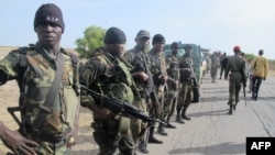 FILE - Cameroon's army soldiers deploy against the Nigerian Islamist group Boko Haram in Dabanga, northern Cameroon, June 17, 2014.