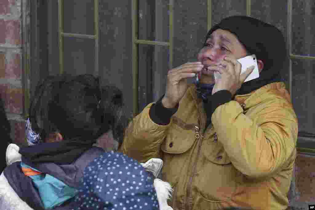 The relative of an inmate cries as she speaks on the phone outside La Modelo jail in Bogota, Colombia. Violence broke out in the prison out of inmates&#39; fears that authorities are not doing enough to prevent coronavirus inside overcrowded prisons.