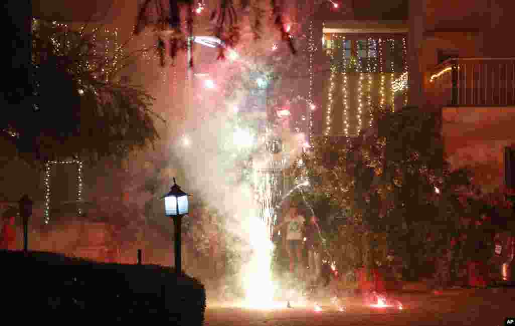 People set off fireworks to celebrate Diwali, Jammu, India, Nov. 3, 2013. 