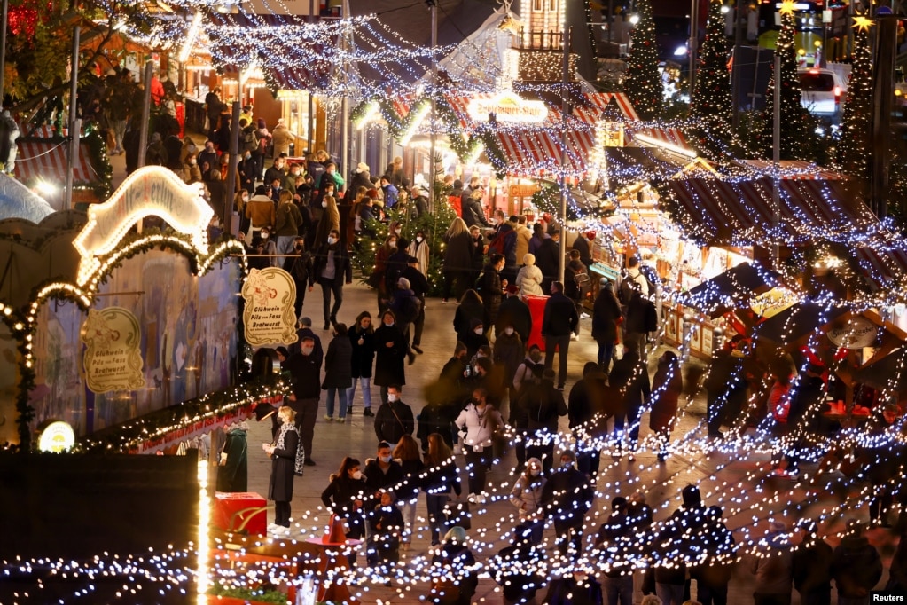 People visit the Breitscheid square Christmas market, amid the COVID-19 pandemic in Berlin, Germany.