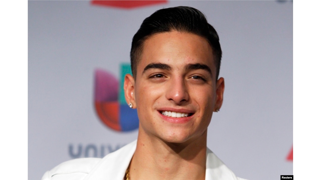 FILE - Maluma poses backstage during the 14th Latin Grammy Awards in Las Vegas, Nevada, Nov. 21, 2013.