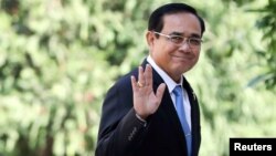 FILE - Thailand's Prime Minister Prayuth Chan-ocha gestures as he leaves after a meeting at Government House in Bangkok, Thailand, Jan. 24, 2019. 