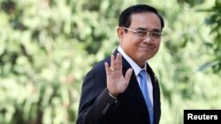 FILE - Thailand's Prime Minister Prayuth Chan-ocha gestures as he leaves after a meeting at Government House in Bangkok, Thailand, Jan. 24, 2019.