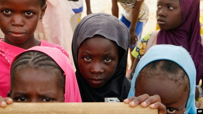 FILE: Displaced children attend class in Dori town, Burkina Faso, Aug. 7, 2021.