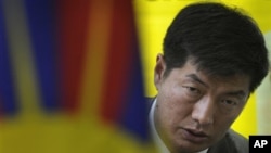 Newly elected head of the Tibetan government-in-exile Lobsang Sangay talks to the media after meeting with Tibetan activists on a hunger strike against blockade of the Kirti monastery in Sichuan province by Chinese forces, in New Delhi, India, Thursday, M