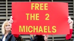 Supporters of Michael Kovrig and Michael Spavor take part in a 5km walk in Ottawa, Ontario on Sept. 5, 2021, as the walk marks 1,000 days for for the pair in Chinese prison after Spavor and Kovrig were charged with espionage.