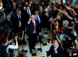 House Republican Whip Steve Scalise walks with his wife Jennifer, left, as he leaves the House chamber in the Capitol in Washington, Sept. 28, 2017.