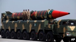 FILE - A Pakistani-made Shaheen-III missile, that is capable of carrying nuclear warheads, is on display during a military parade in Islamabad, Pakistan, March 23, 2018. 