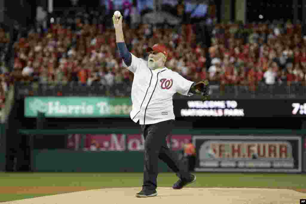 Chef, Jose Andres throws out the first pitch before Game 5 of the baseball World Series between the Houston Astros and the Washington Nationals Sunday, Oct. 27, 2019, in Washington, D.C.