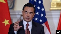 Chinese Foreign Minster Wang Yi speaks at the State Department in Washington, Sept. 19, 2013.