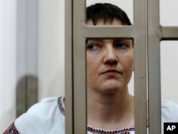 Ukrainian jailed military officer Nadezhda Savchenko stands in a glass cage during a trial in the town of Donetsk, Rostov-on-Don region, Russia on March 3, 2016.