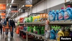 FILE - Shoppers browse in a Home Depot building supplies store in north St. Louis, Missouri, April 4, 2020.