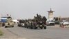 گروهی از نیروهای امنیتی عراق و شبه نظامیان شیعه در حال آماده شدن برای حمله به مواضع پیکارجویان داعش در تکریت
