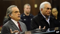 Dominique Strauss-Kahn, head of the International Monetary Fund, right, with his attorney Benjamin Brafman, is arraigned Monday, May 16, 2011, at Manhattan Criminal Court in New York.