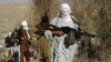 FILE - Armed Taliban fighters are seen at an undisclosed location in Nangarhar province, Afghanistan, Dec. 13, 2010. Taliban fighters are currently engaged in clashes with Islamic State militants in the region.