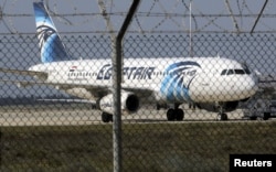 FILE - An Egyptair Airbus A320 airbus stands on the runway at Larnaca Airport in Larnaca, Cyprus.