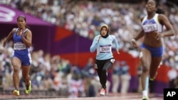  Afghanistan's Tahmina Kohistani competes in a women's 100-meter heat during the athletics in the Olympic Stadium at the 2012 Summer Olympics, London, August 3, 2012.
