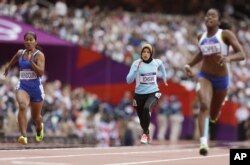 FILE - Afghanistan's Tahmina Kohistani competes in a women's 100-meter heat during the athletics in the Olympic Stadium at the 2012 Summer Olympics, London, Aug. 3, 2012.
