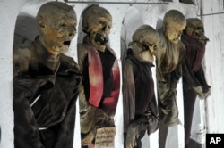 FILE - This photo taken Oct. 2, 2009, shows a view of mummified corpses in the Capuchins' Catacombs in Palermo, Sicily, southern Italy.