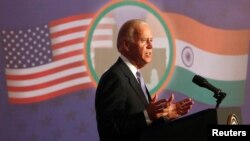 U.S. Vice President Joe Biden delivers an address at the Bombay Stock Exchange (BSE) in Mumbai July 24, 2013. 