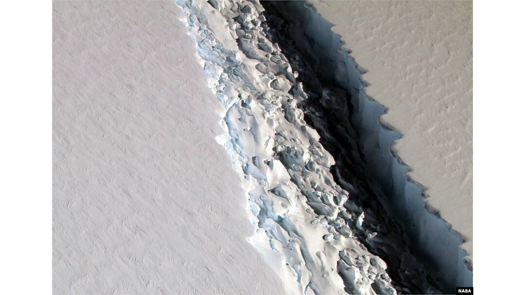 This Nov. 10, 2016 aerial photo released by NASA, shows a rift in the Antarctic Peninsula's Larsen C ice shelf. According to NASA, IceBridge scientists measured the Larsen C fracture to be about 70 miles long, more than 300 feet wide and about a third of a mile deep.