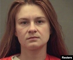 FILE - Maria Butina appears in a police booking in Alexandria, Va., Aug. 18, 2018.