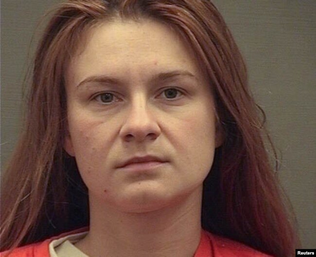 FILE - Maria Butina appears in a police booking in Alexandria, Va., Aug. 18, 2018.