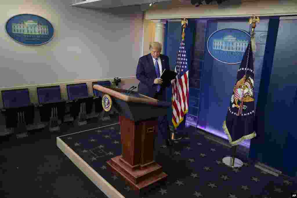 President Donald Trump arrives for a news conference at the White House, Wednesday, July 22, 2020, in Washington. (AP Photo/Evan Vucci)