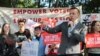 The founder of "Let America Vote" speaks to protesters gathered outside Saint Anselm College in Manchester, N.H., where the Trump administration's commission on voter fraud met on Sept. 12, 2017.