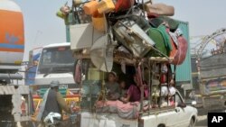 Afghan refugees who fled their country due to war return to Afghanistan at the Chaman border in Pakistan, Friday, Sept. 9, 2016. 