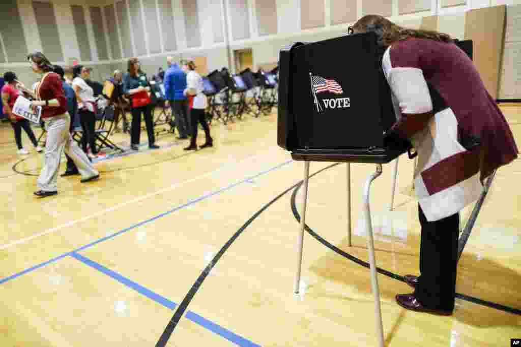 Voters cast their ballots at the Whetstone Community Center polling location, Nov. 6, 2018, in Columbus, Ohio.