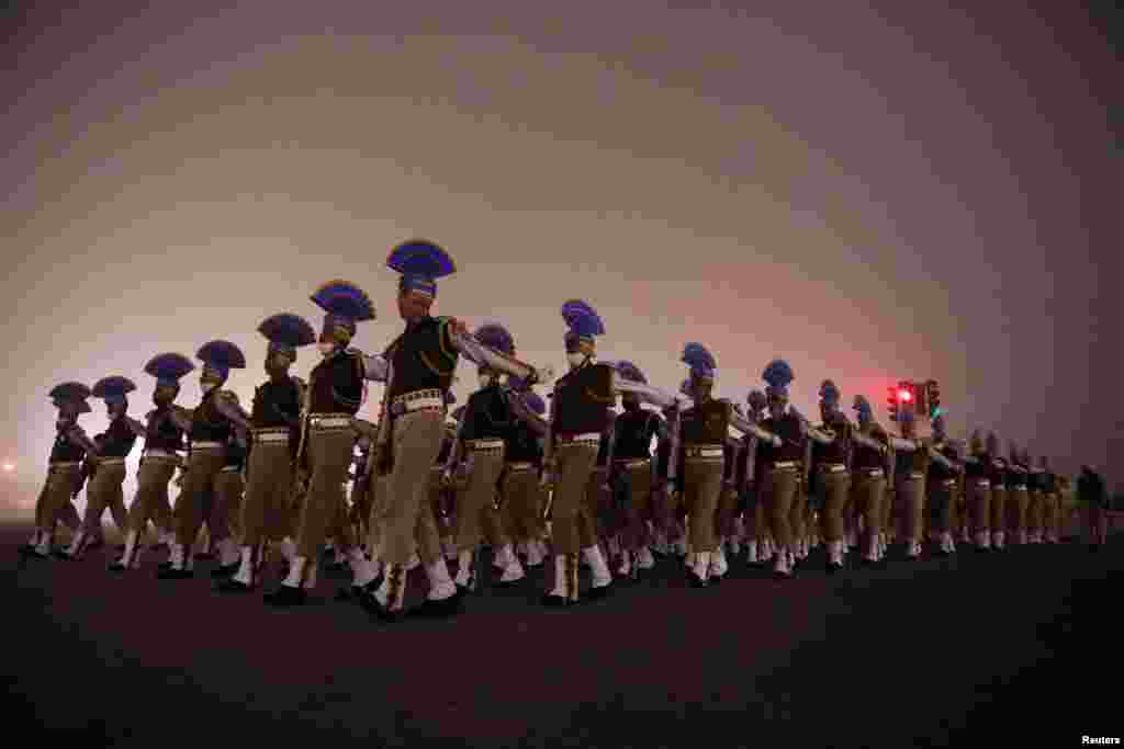 Indian Army soldiers take part in the rehearsal for the Republic Day parade on a foggy winter morning, in New Delhi, India.