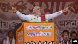 Indian Prime Minister Narendra Modi addresses a youth rally organized by the Bharatiya Janata party (BJP) ahead of Assam state elections in Gauhati, India, Jan. 19, 2016.