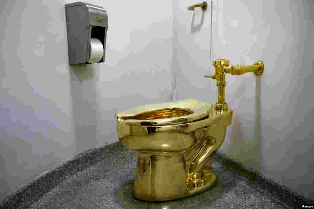 Maurizio Cattelan’s “America,” a fully functional solid gold toilet, is seen at The Guggenheim Museum in New York, Aug. 30, 2017.