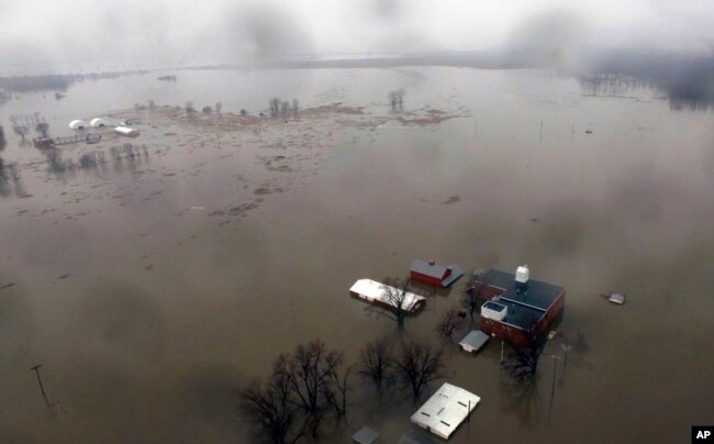 An aerial photo shows flooding along the Missouri River in Pacific Junction, Iowa, March 19, 2019.