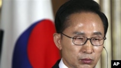 South Korea's President Lee Myung-bak attends a joint news conference with Chinese Premier Wen Jiabao and Japanese Prime Minister Naoto Kan following their summit meeting at the Akasaka State Guesthouse in Tokyo on Sunday, May 22, 2011.