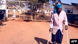 FILE - Malawi’s longest-serving witchcraft prisoner Ezereti Kampota walks to freedom from Maula Maximum Security Prison, in Lilongwe after the Association of Secular Humanism and its Executive Director George Thindwa became advocates for her release, May 31, 2011.